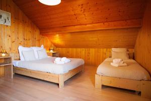 Posteľ alebo postele v izbe v ubytovaní Chalet l'OURSON à Gérardmer, vue imprenable lac
