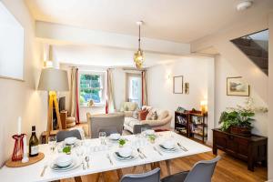 a living room with a table and chairs at Edge Cottage in Curbar