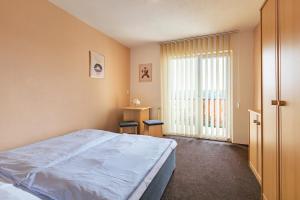 Postel nebo postele na pokoji v ubytování Hotel Sobol