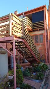a wooden staircase leading up to a house at The Willery Guesthouse in Dimboola