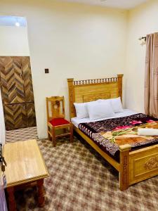 Postel nebo postele na pokoji v ubytování MANOKUR - E- BASA HOTEl