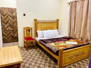 Postel nebo postele na pokoji v ubytování MANOKUR - E- BASA HOTEl