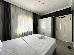Postel nebo postele na pokoji v ubytování Casa Florya Travel Apartments