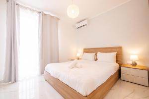 Postel nebo postele na pokoji v ubytování Sea breeze
