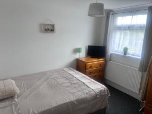 Postel nebo postele na pokoji v ubytování Phoenix House + 5 fotografií