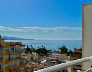 a view of the ocean from the balcony of a building at Apartamento Bambú in Torre del Mar