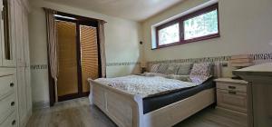Postel nebo postele na pokoji v ubytování Apartmán U jezírka - Relax v Chřibech - Kroměříž - Kostelany