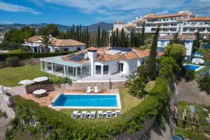 an aerial view of a house with a swimming pool at Villa Vista Verde Mijas Golf - Luxury with Optional heated pool & jacuzzi in Mijas