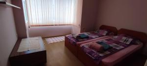 Postel nebo postele na pokoji v ubytování Central Base Varna