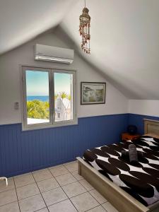 VILLA POINTE DES CHATEAUX VUE IMPRENABLE客房内的一张或多张床位