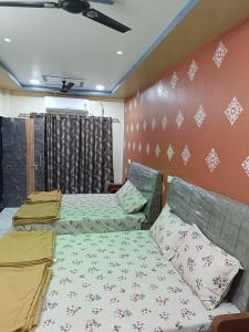 Postel nebo postele na pokoji v ubytování Atithi home stay