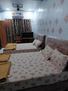 Postel nebo postele na pokoji v ubytování Atithi home stay