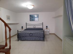 a bedroom with a bed and two night stands at Poseidone Ponza in Ponza