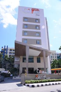 a building with a sign in front of it at Citrus Classic Bengaluru in Bangalore