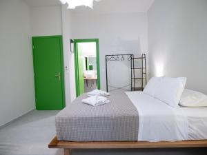 Postel nebo postele na pokoji v ubytování Mondrian Guest House