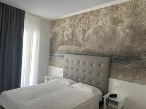 Postel nebo postele na pokoji v ubytování Hotel President