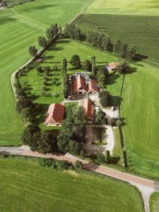 an aerial view of a house in the middle of a field at Havezathe Carpe Diem in Vethuizen