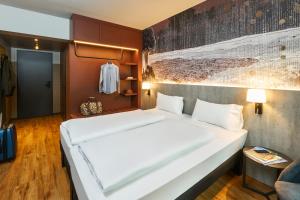 Postel nebo postele na pokoji v ubytování Ibis Styles Singen