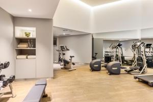 a gym with treadmills ellipticals and exercise bikes at Áurea Museum by Eurostars Hotel Company in Lisbon +88 photos