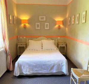 Postel nebo postele na pokoji v ubytování Le Relais Notre Dame