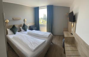 Una cama o camas en una habitación de Hotel Imperial