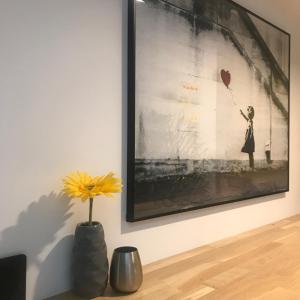 a painting of a woman holding a heart balloon at La Galerie, Et Pop Et Chic ! in Poitiers