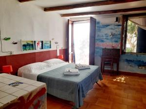 Ένα ή περισσότερα κρεβάτια σε δωμάτιο στο Villino Miraglia