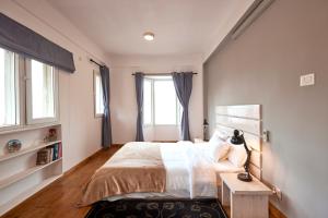 a bedroom with a large bed and a window at Ananya Apartments Phase 1 in Kathmandu