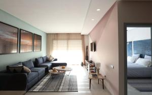 a living room with a couch and a bed at Immi in Agadir