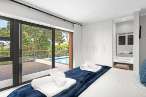 Postel nebo postele na pokoji v ubytování San Lameer Villa 14208- 4 Bedroom Premier - 8 pax - San Lameer Rentals Agency + 37 fotografií