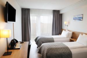 TV a/nebo společenská místnost v ubytování Fosshotel Nupar