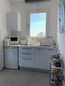 Kuchyň nebo kuchyňský kout v ubytování Casa Vacanze Baciata
