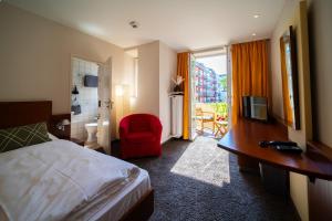 TV a/nebo společenská místnost v ubytování Hotel Carlton Munich