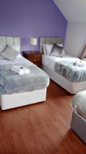 Voodi või voodid majutusasutuse Tullynacrunat Lodge toas