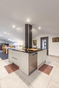 a kitchen with a large island in the middle at Crestuma Bright Apartment, by Hopstays in Crestuma