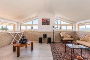 a living room with a couch and a table at Crestuma Bright Apartment, by Hopstays in Crestuma