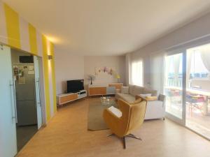 a living room with a couch and a table at Cozy 2BR apartment next to Club Higueron Resort in Fuengirola