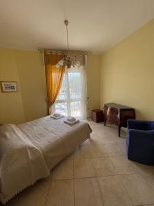 Postel nebo postele na pokoji v ubytování Luminosa casa con posto auto in Versilia a 5 min dal mare