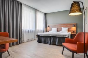 Postel nebo postele na pokoji v ubytování Quality Hotel Grand Kristianstad
