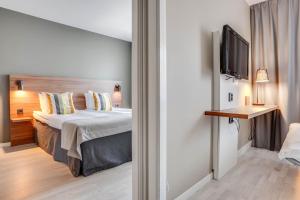 Postel nebo postele na pokoji v ubytování Quality Hotel Grand Kristianstad
