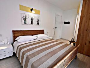 Postel nebo postele na pokoji v ubytování Residenza Delfina