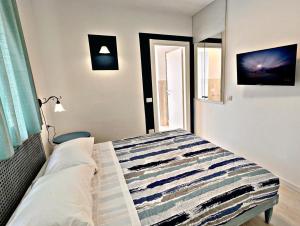 Postel nebo postele na pokoji v ubytování Residenza Delfina