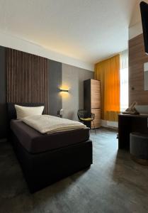 Postel nebo postele na pokoji v ubytování Hotel Garni „zum Bären“