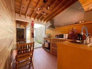 a kitchen with a sink and a counter top at Casa do Pescador 14 in Vila Franca do Campo
