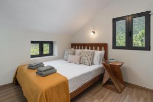 Ένα ή περισσότερα κρεβάτια σε δωμάτιο στο OurMadeira - Casa Hortênsia