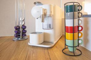 a food processor sitting on top of a table at Bayline Cond - Sea View - SPA - Pool - GYM - Truta BY BEDZY in Armação de Pêra