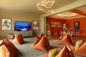 a room with a bunch of pillows on the floor at New Park Manor Hotel - A Luxury Family Hotel in Brockenhurst