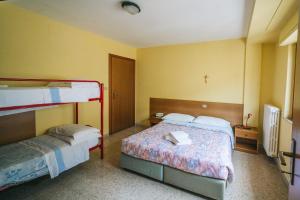 Posteľ alebo postele v izbe v ubytovaní Fortezza