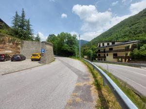 a street with cars parked on the side of a road at Casa Chiara by Holiday World in Limone Piemonte