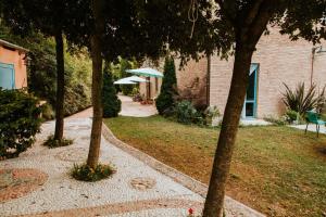 A garden outside Italian Experience-Villa Millefiori
